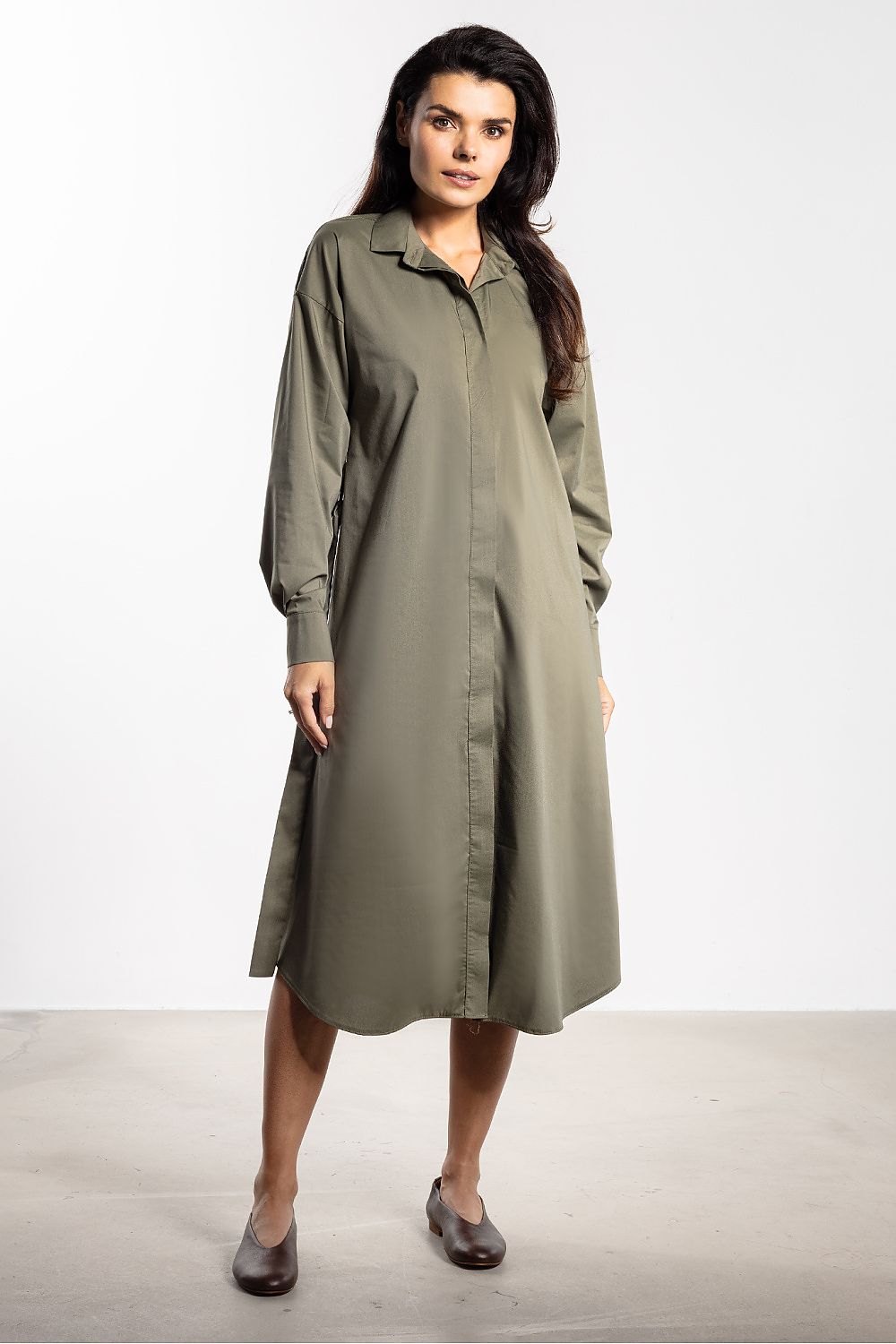 Elegant midi shirt dress by Awama featuring a classic collar and button detail, perfect for versatile styling.