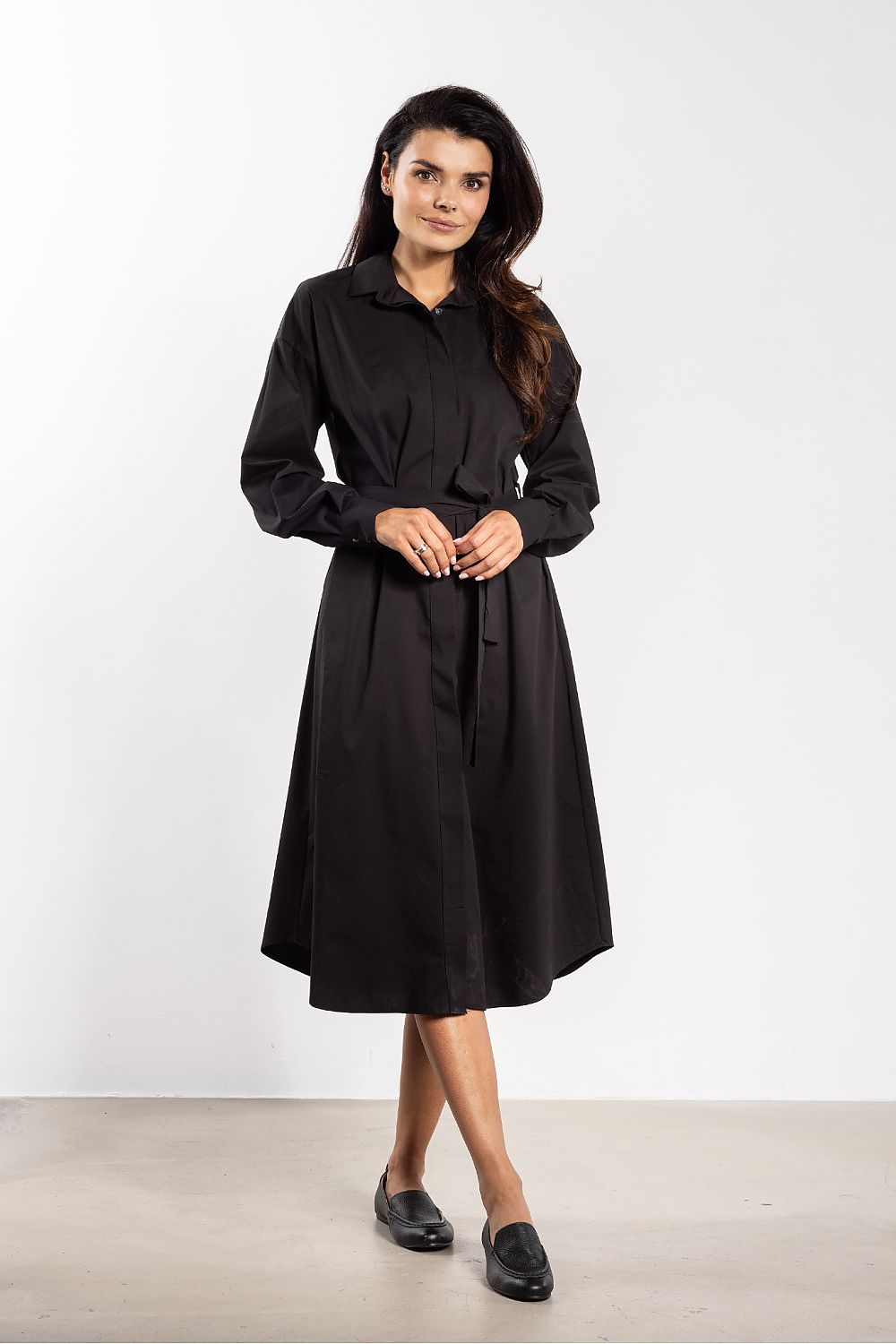 Stylish belted midi shirt dress by Awama, highlighting its flattering silhouette and luxurious fabric blend.