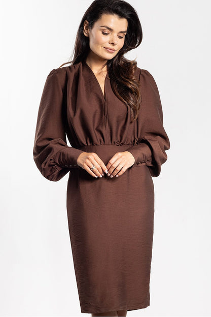 Back view of the luxurious midi dress by Awama, highlighting the sophisticated design and craftsmanship.