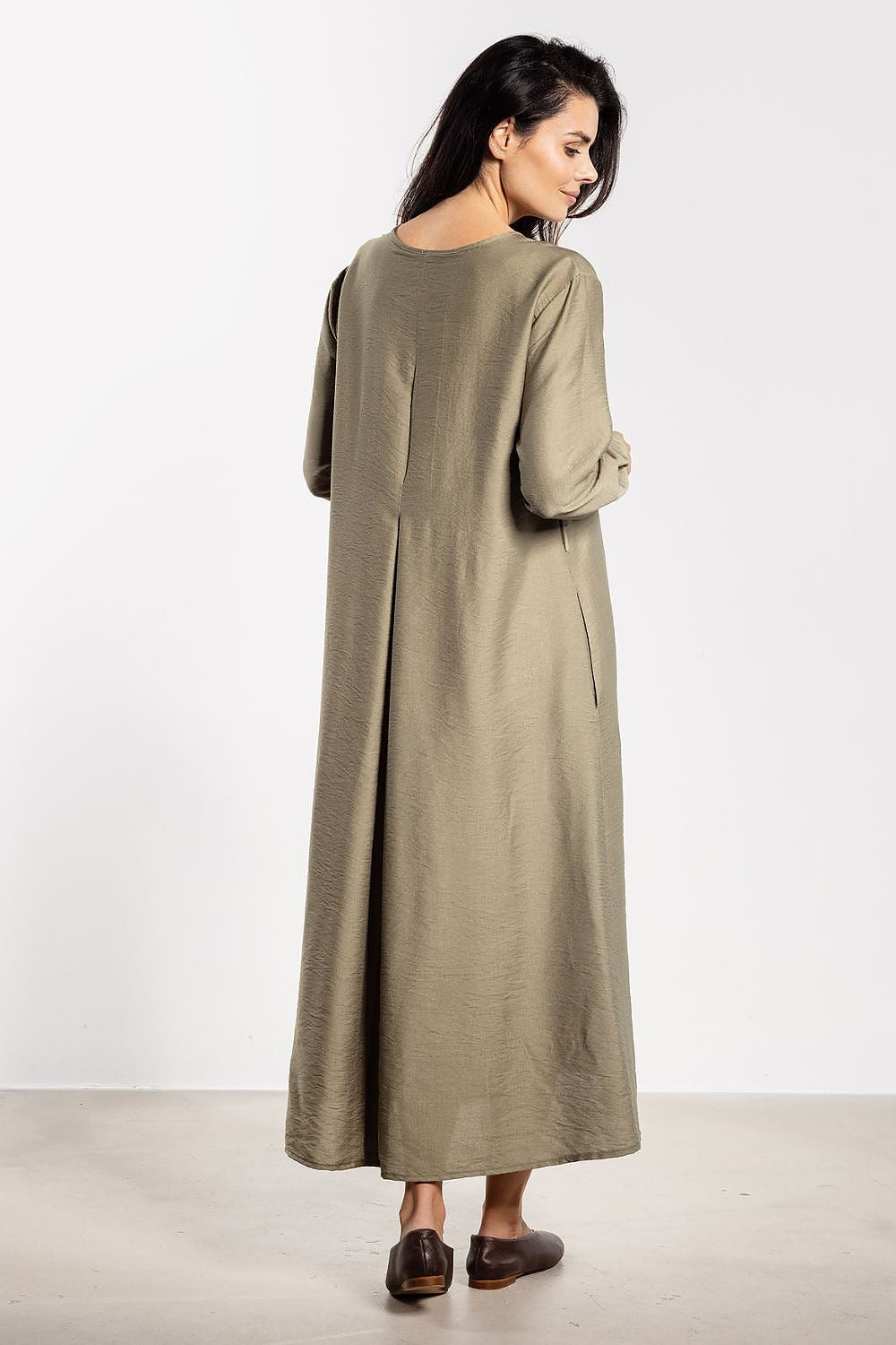 Luxurious awama ankle-length A-Line maxi dress, adorned with delicate buttons and comfortable long sleeves.