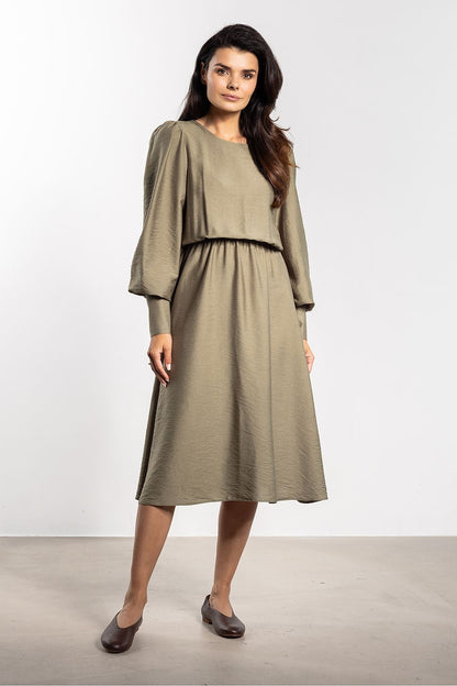 Elegant Midi Dress by Awama in soft fabric showcasing a loose cut and elastic waistband, perfect for a luxurious silhouette.