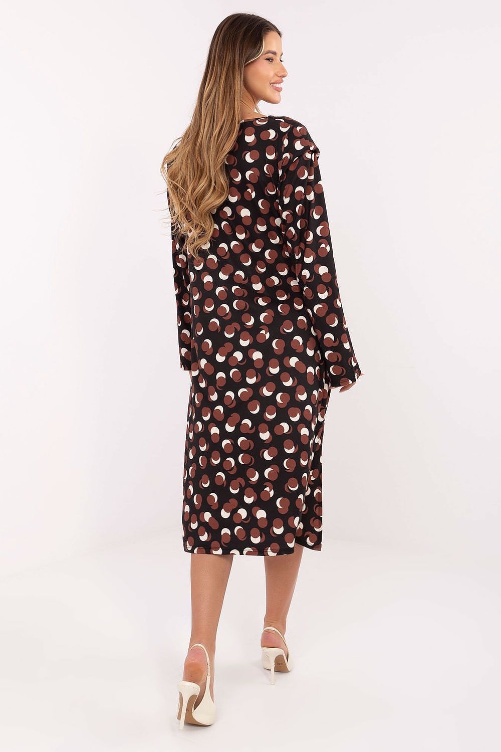 Model wearing Rue Paris elegant midi dress with shoulder pads, displaying a flattering draped design that enhances femininity and style.