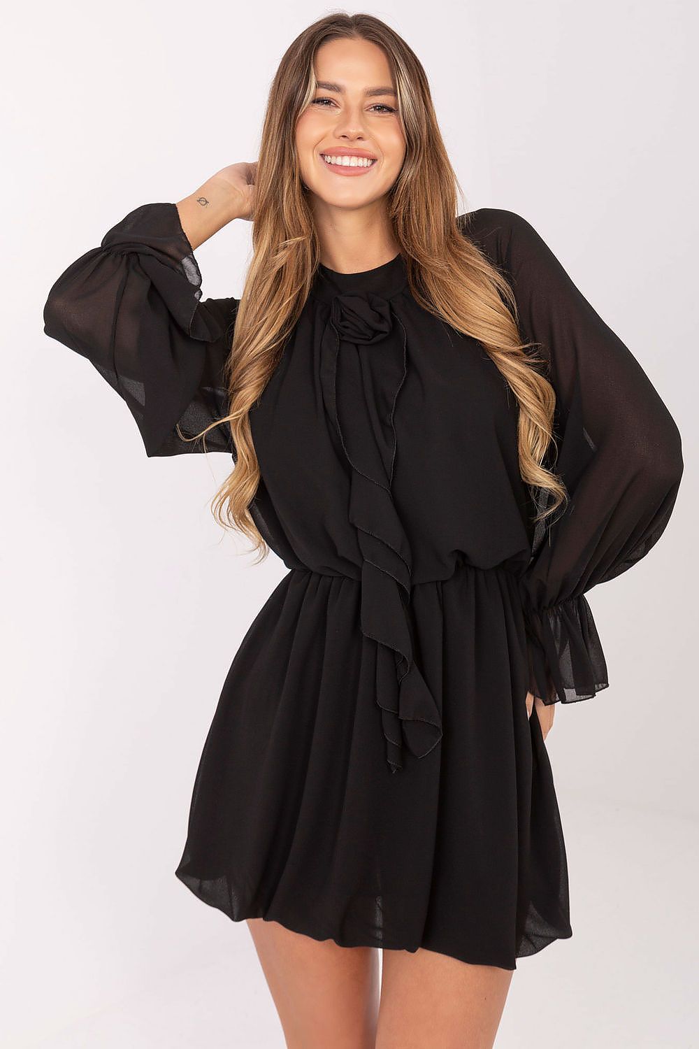 Detail shot of long sleeves on Rue Paris mini cocktail dress, featuring delicate ruffles that add sophistication and grace to the overall look.