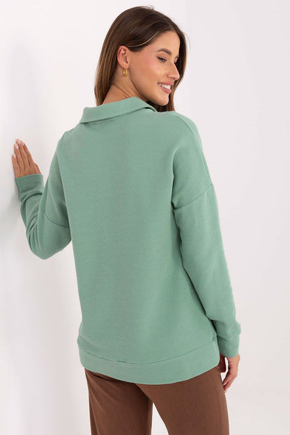 Lakerta women's polo shirt, featuring a timeless design with long sleeves and a sophisticated collar.