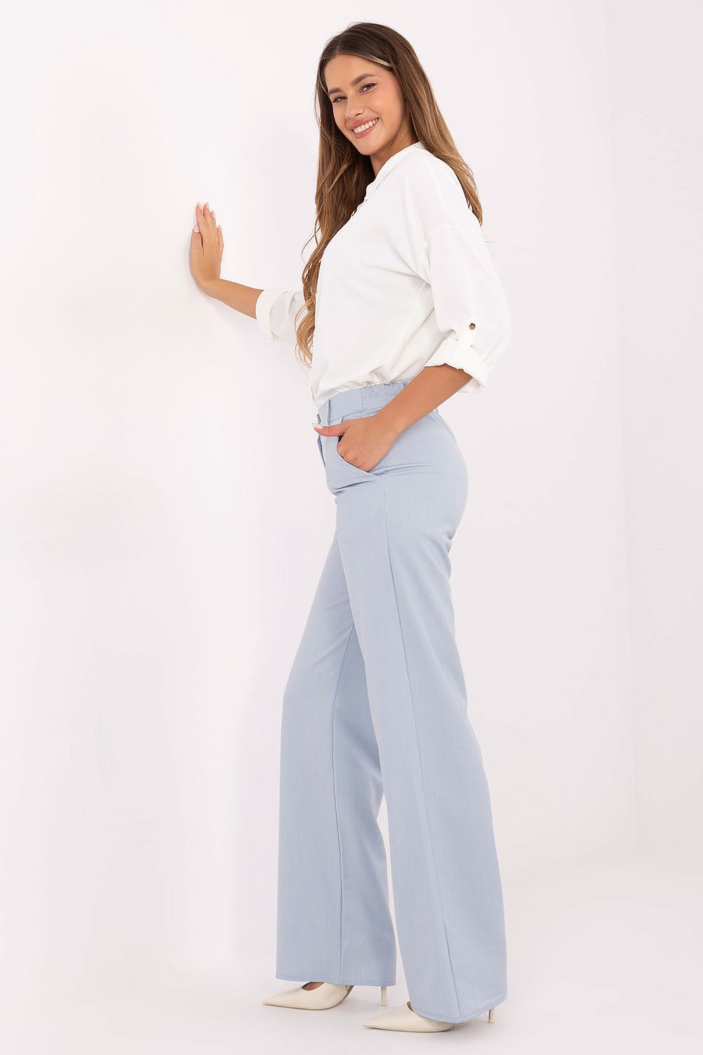Lakerta high-waisted trousers styled with a refined top, showcasing the sophisticated blend of comfort and luxury for everyday elegance.