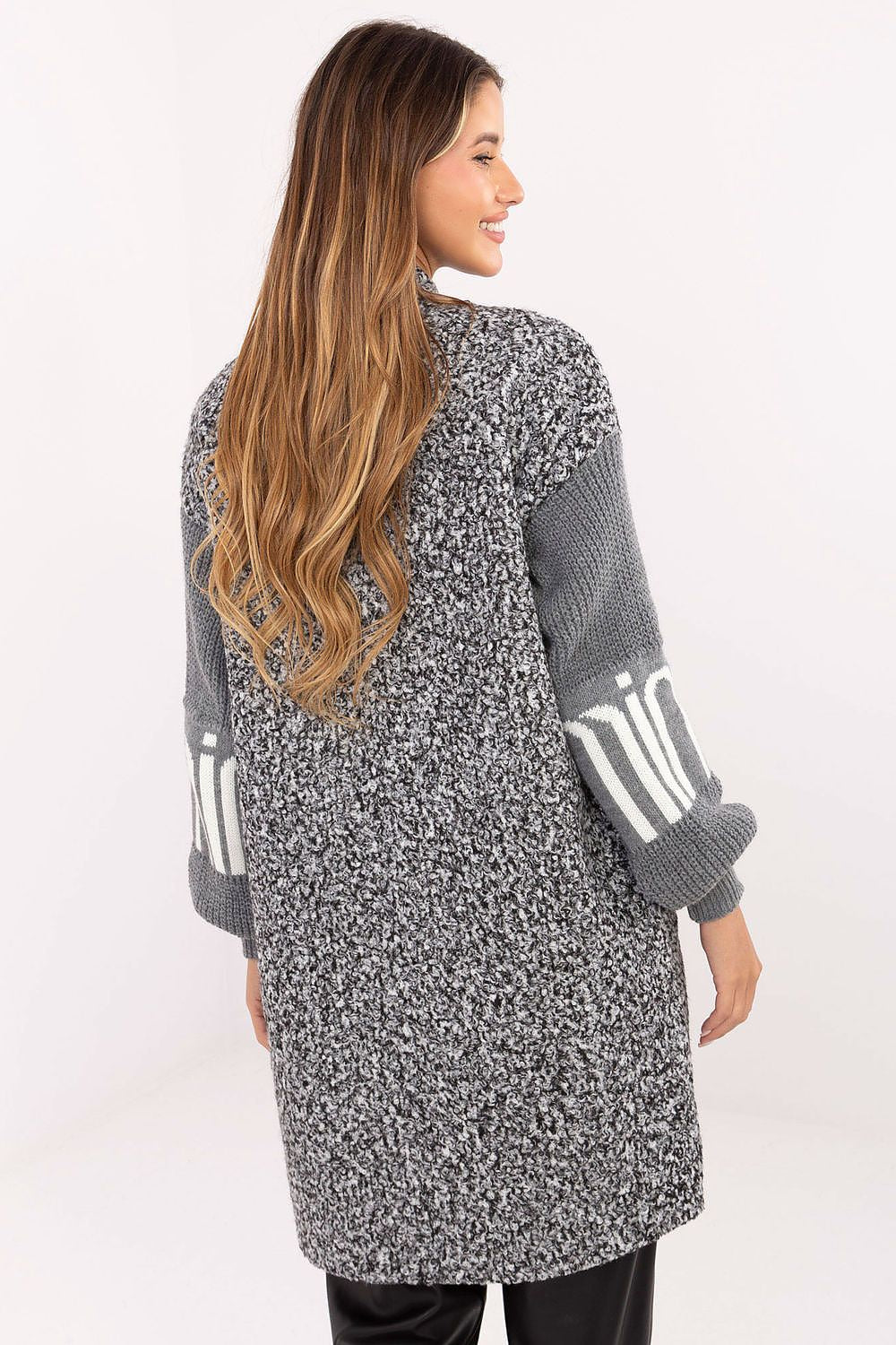 Soft polyester boucle cardigan for women from Factory Price, featuring textured material and stylish puffy knitted sleeves for a luxurious look.