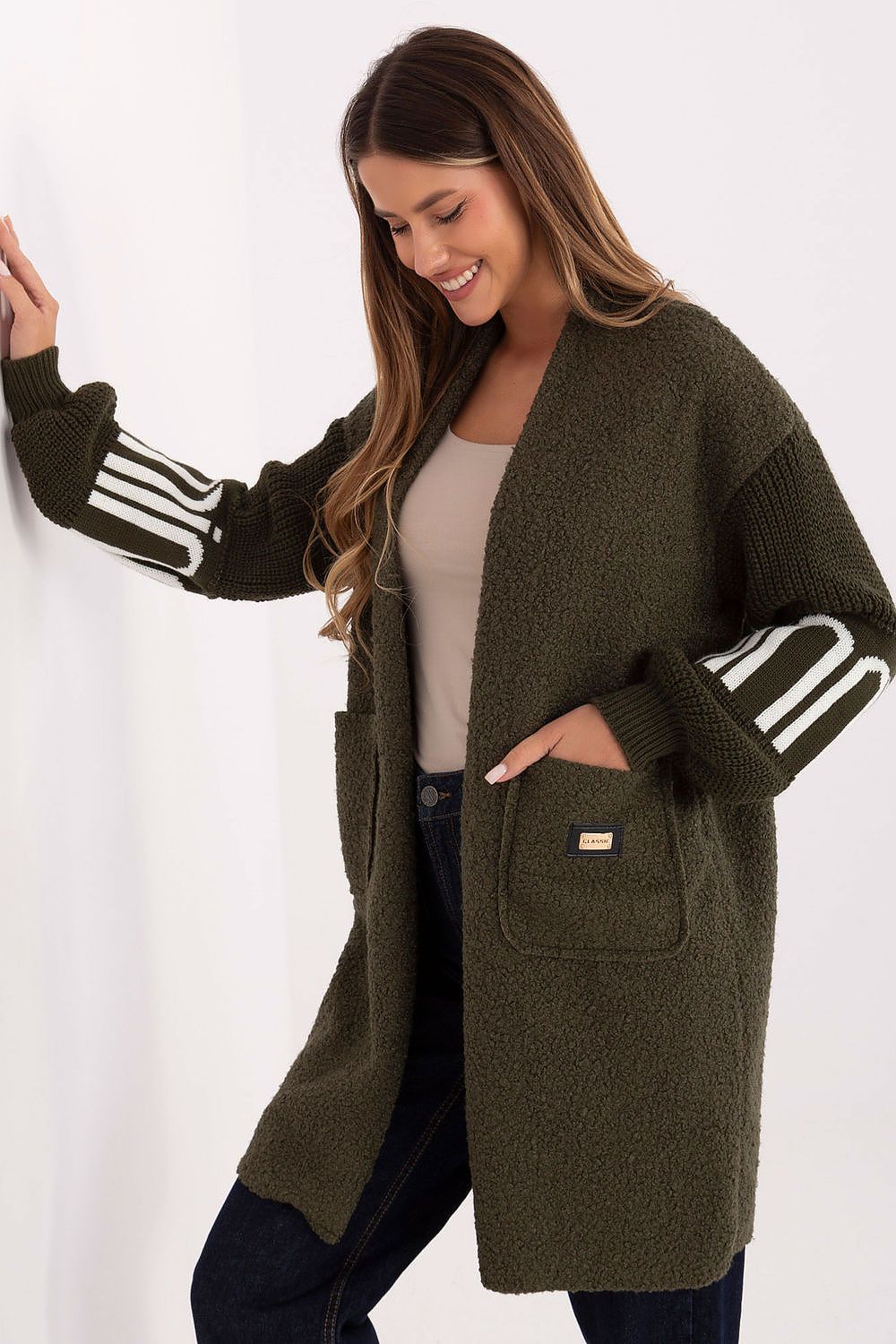 Luxurious knee-length women's boucle cardigan from Factory Price, showcasing puffed knitted sleeves and unique patch detail for a chic look.