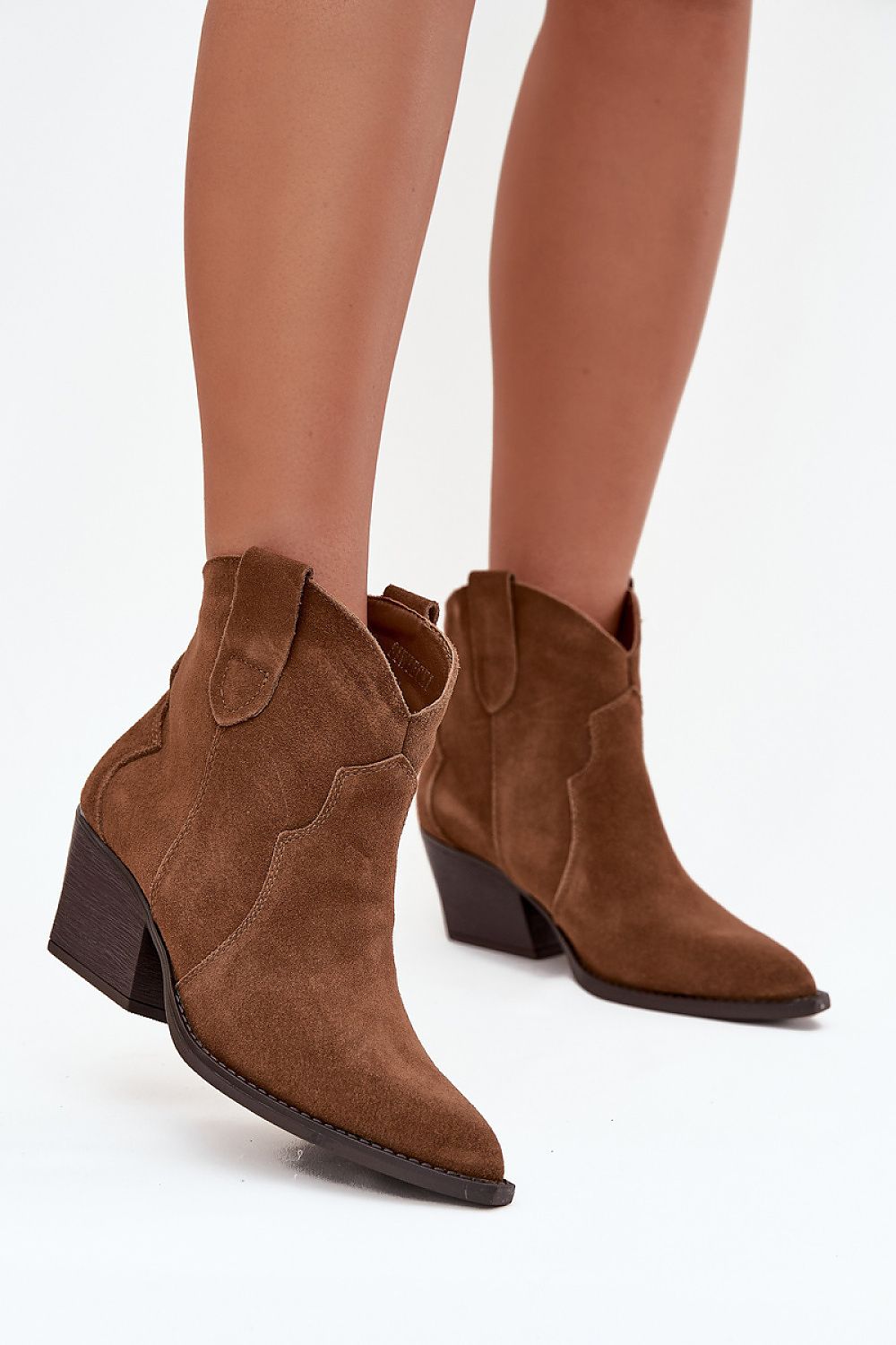 Elegant view of Slip-on Women's Suede Ankle Boots by Step in style, capturing their unique cut heel and western-inspired aesthetic.