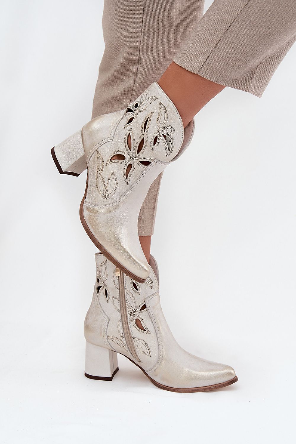 Beautifully designed women's ankle boots with zipper closure and lacy patterns, epitomising elegance from Step in Style.