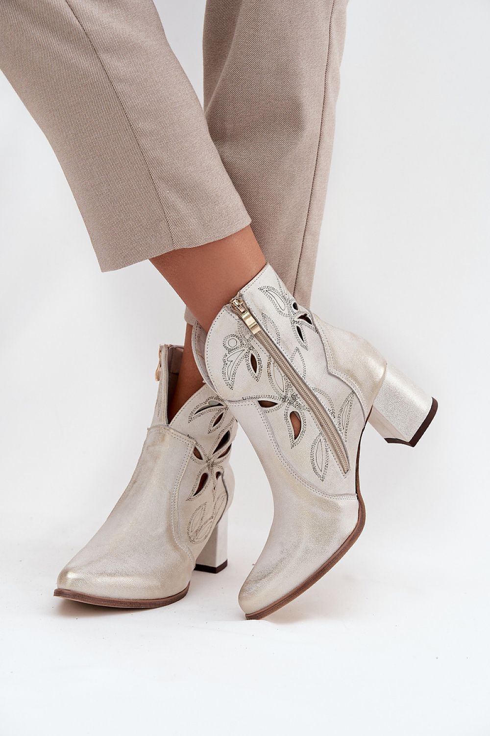 Elegant natural leather ankle boots for women by Step in Style, showcasing a graceful pointed toe and stylish column heel.