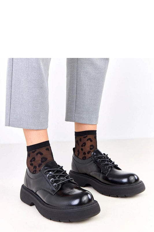 Solea elegant platform half shoes for women, showcasing a stylish design in black synthetic leather, a round toe, and a 4 cm stable platform for ultimate comfort and sophistication.