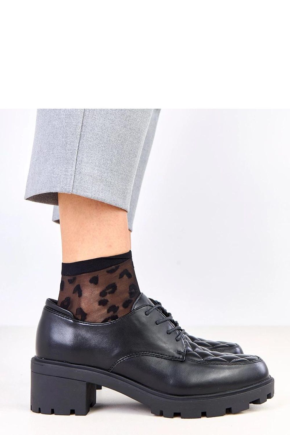 Close-up of Solea Quilted Lace-Up Heeled Shoes, highlighting the unique quilted front insert and genuine leather insole, offering a blend of comfort and luxury.