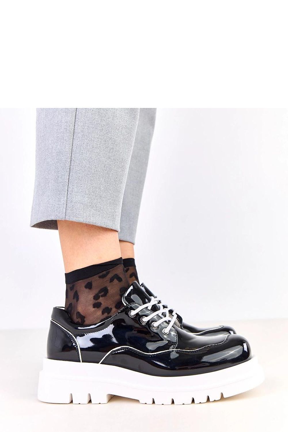 Stylish display of Solea Women's Polished Half Shoes showcasing the glossy finish and comfortable fit, perfect for modern urban elegance.