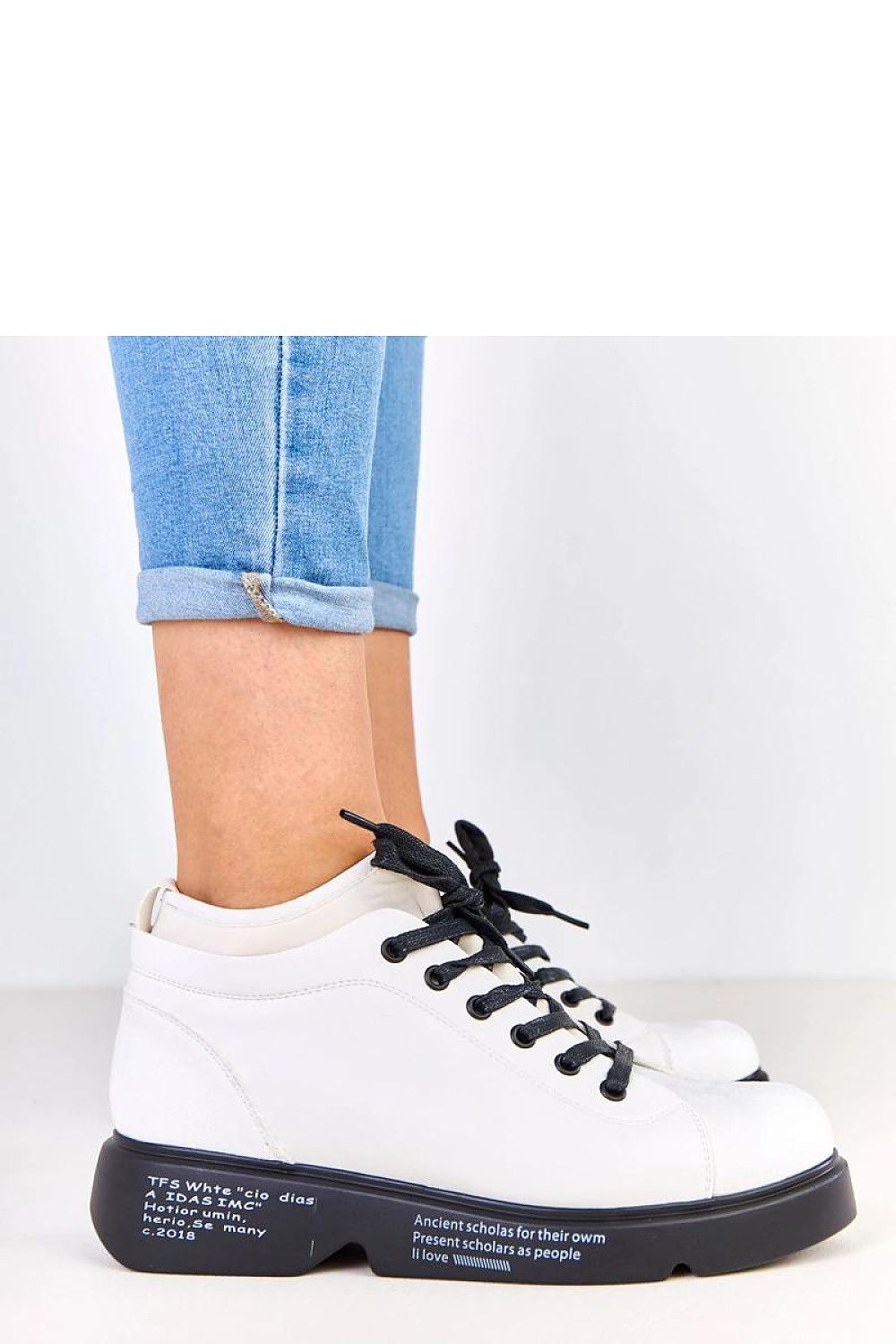 Close-up of Solea's stylish platform half shoes for women, showcasing the decorative inscription and high-quality eco-leather finishing.