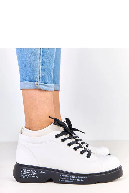 Close-up of Solea's stylish platform half shoes for women, showcasing the decorative inscription and high-quality eco-leather finishing.