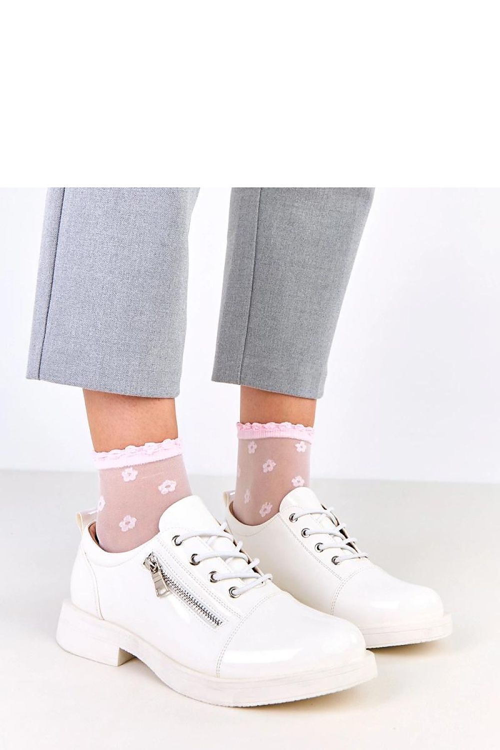 Solea lacquered lace-up shoes featuring a decorative buckle, showcasing elegant synthetic leather design ideal for modern luxury fashion.