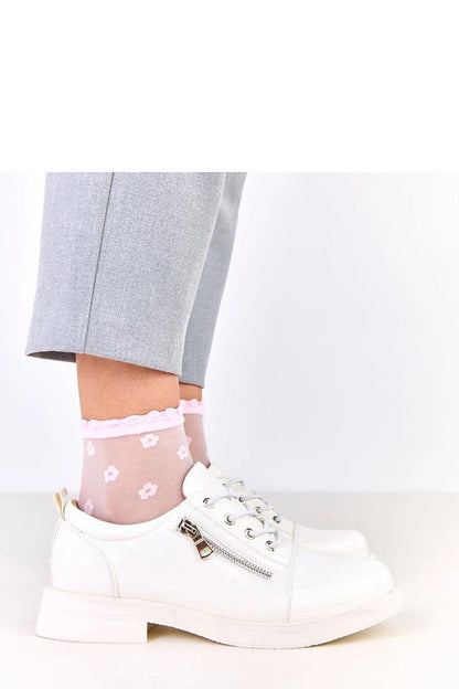 Close-up of Solea's stylish lace-up shoes with buckle detail, exemplifying premium craftsmanship and sophisticated urban styling.