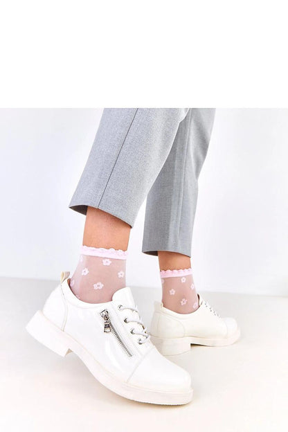 Side profile of Solea lacquered shoes, highlighting the rounded toe and 3 cm low heel, merging comfort with elegant luxury.