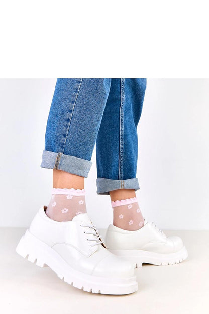 Solea Half Shoes on display, highlighting their versatile silhouette and modern tractor platform, ideal for fashion-forward individuals.