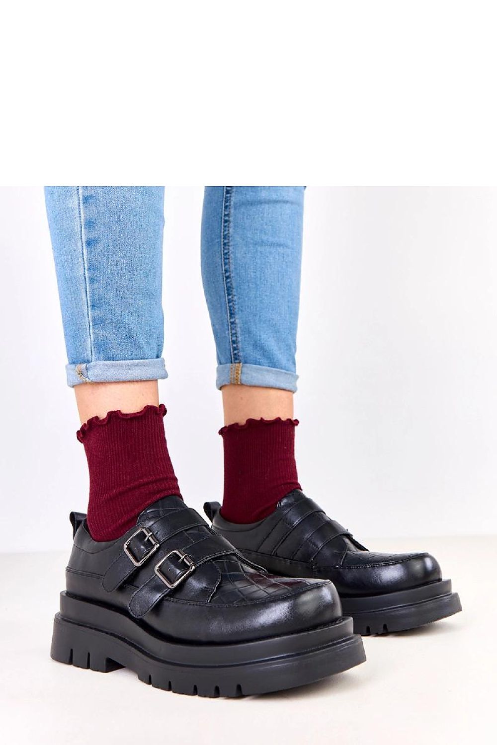 Close-up of Solea slip-on shoes featuring decorative buckles, crafted from high-quality eco-leather for a chic and sophisticated look.