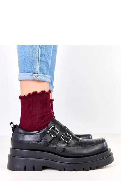 Solea slip-on platform shoes presented in a stylish setting, demonstrating versatility for both everyday wear and elegant occasions.