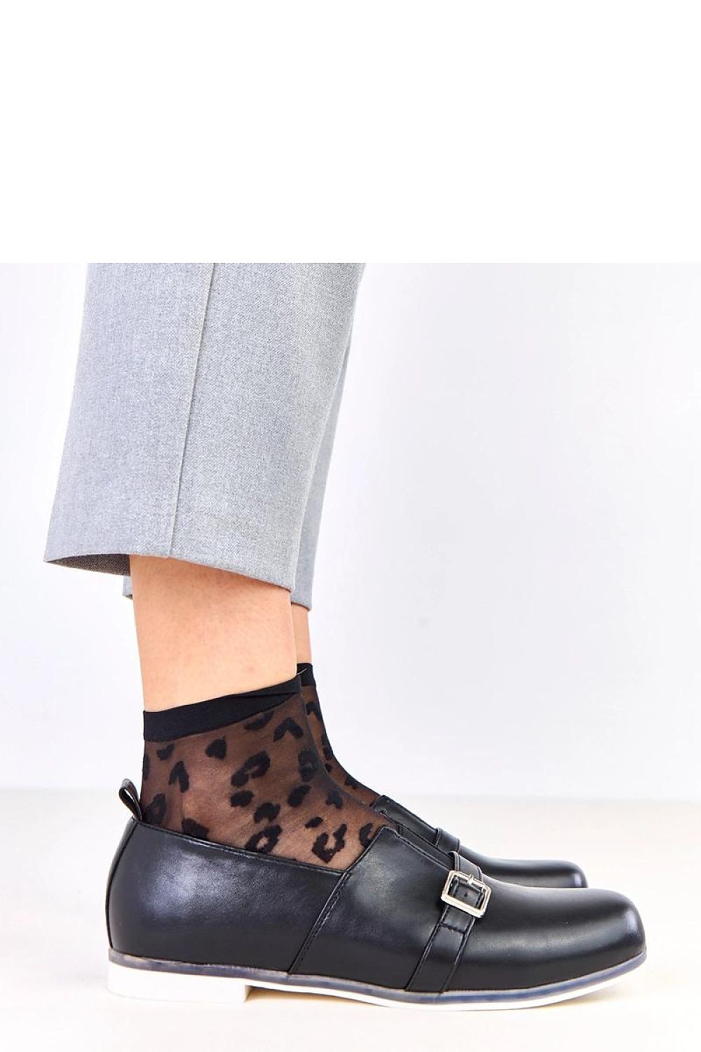 Stylish Solea slip-on half shoes made from high-quality eco-leather, showcasing a minimalist design with an eye-catching decorative buckle.