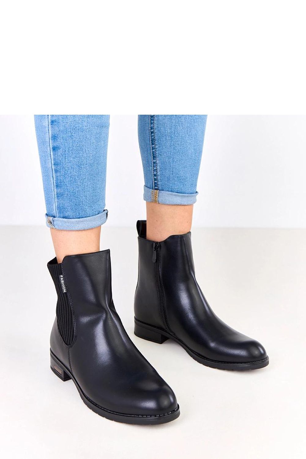 Close-up of Solea eco-leather boots showcasing the side zipper and elastic insert detail, embodying luxury and comfort for everyday wear.