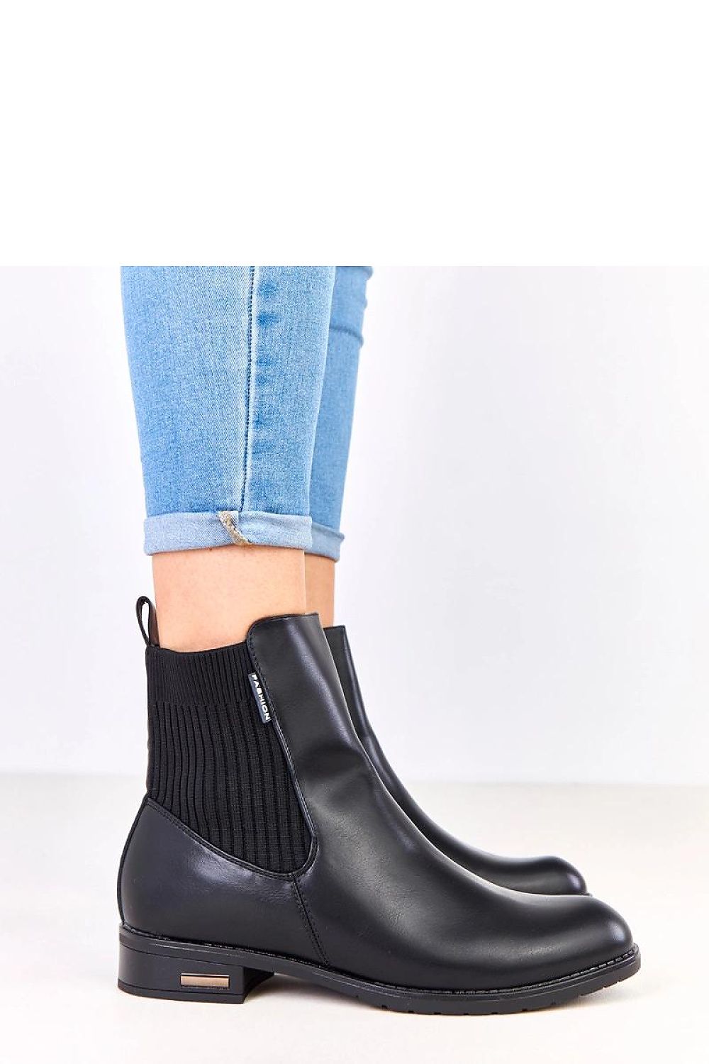 Close-up view of Solea eco-leather boots showcasing the luxurious finish and practical side zipper; perfect blend of elegance and comfort for cold days.