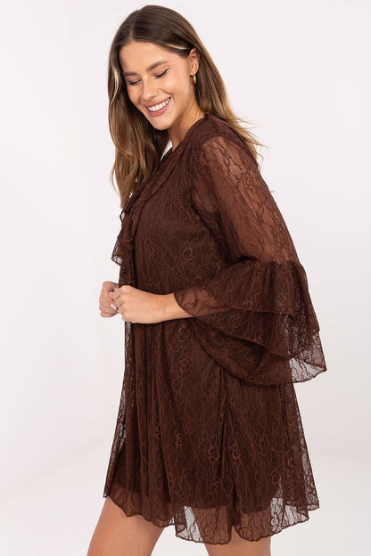 Close-up of Italy Moda's delicate lace texture and romantic ruffle details on the mini length evening dress.