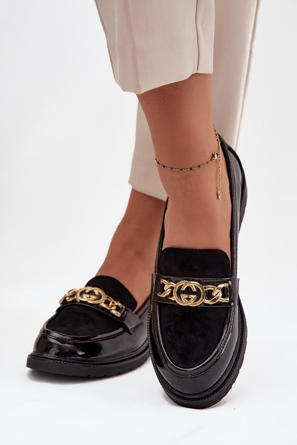 Elegant women's eco-leather loafers with a luxurious golden ornament, designed by Step in Style, combining comfort and sophistication.