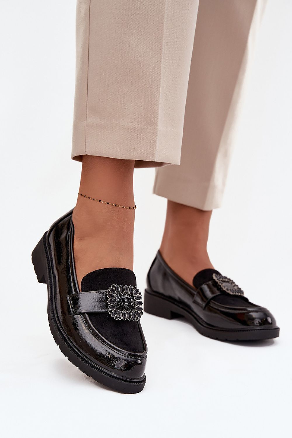 Elegant women's moccasins by Step in Style featuring a decorative buckle, perfect for any stylish occasion.