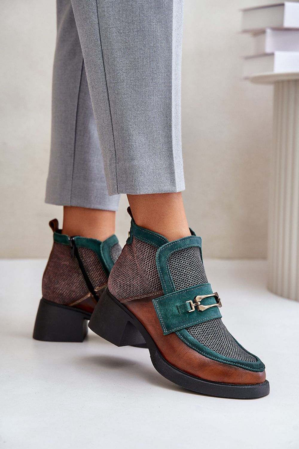 Maciejka ankle boots displayed in various angles, highlighting the chic design and comfort, available in sizes EU 36-41, offered by Step in Style.