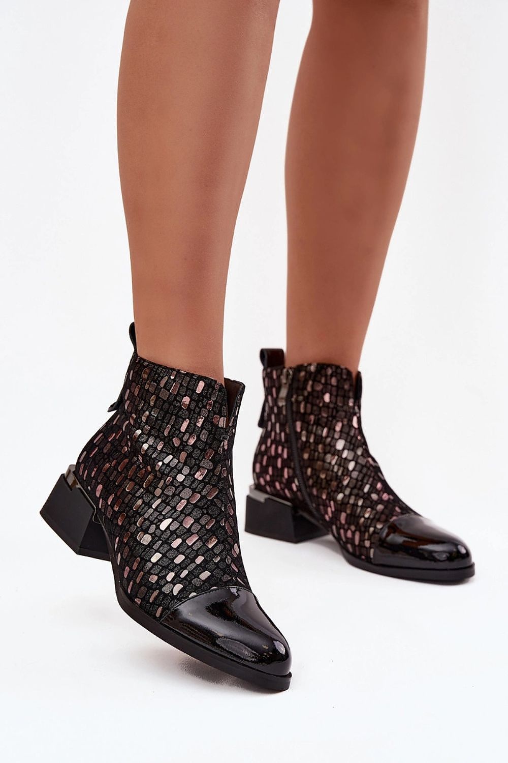 Chic women's ankle boots from Step in Style, featuring a 10.5 cm upper height and 4.5 cm block heel, ideal for sophisticated looks and everyday wear.