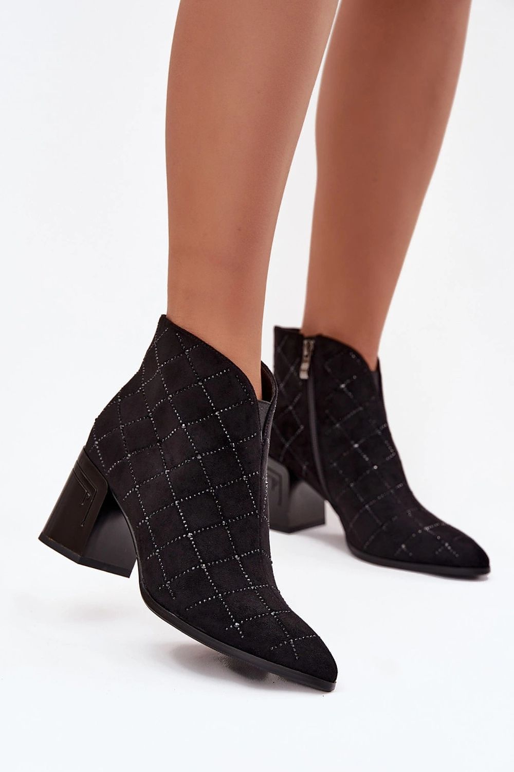 Elegant women's faux suede ankle boots by Step in Style, featuring a 7.5cm heel and almond toe design, perfect for evening outings and special occasions.