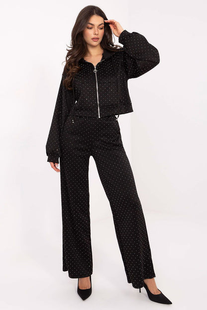 Stylish model wearing Rue Paris elegant women's tracksuit set, highlighting the fashion-forward design and sophisticated look.