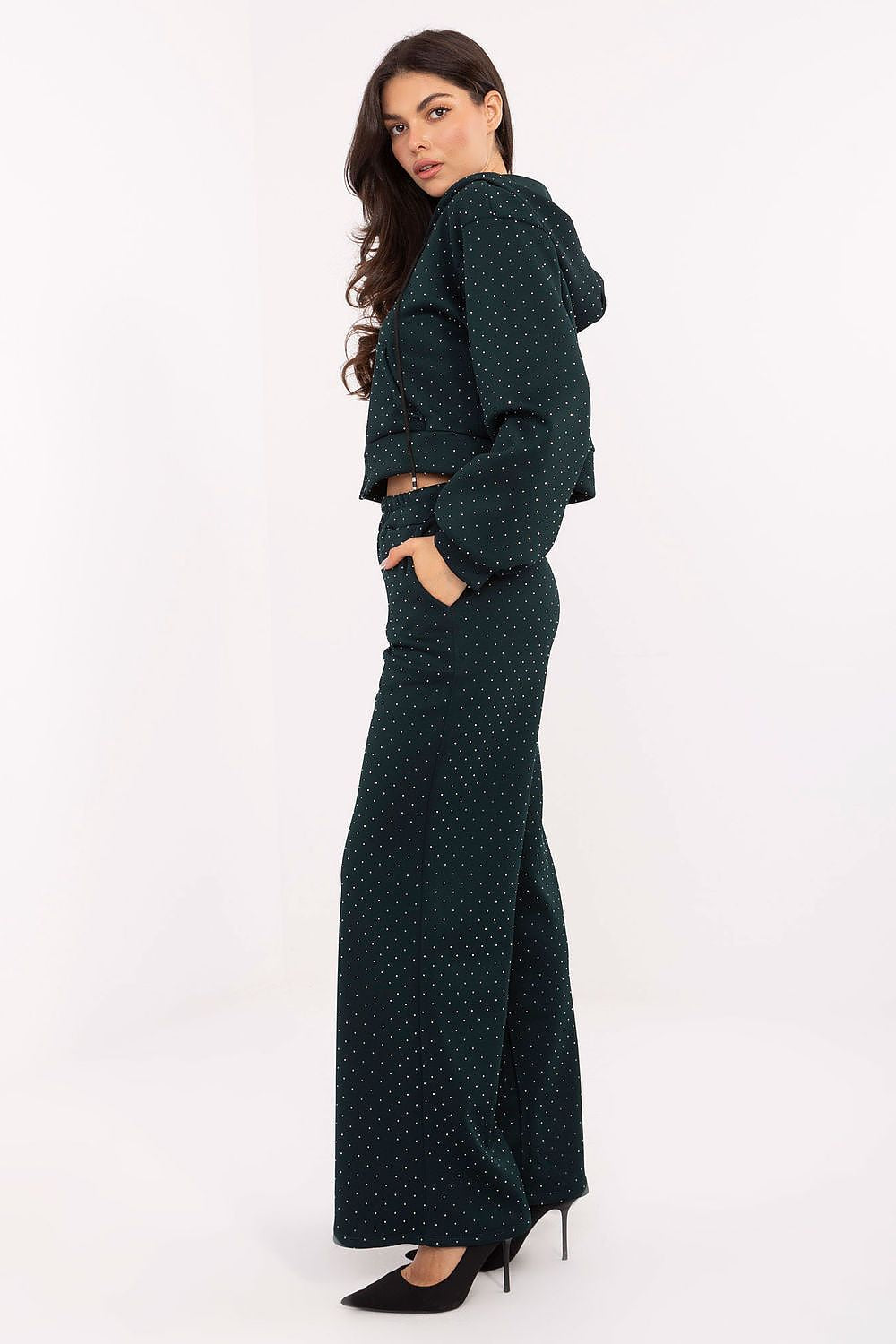 Close-up of Rue Paris elegant women's tracksuit set, highlighting the luxurious texture and jet application detail on the zip-up hoodie and high-waisted pants.