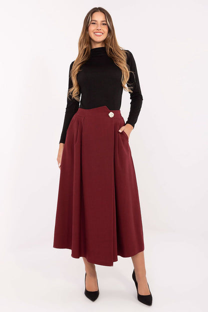 Close-up view of the elegant pleated front of the Rue Paris Midi Skirt, highlighting its premium polyester fabric and feminine silhouette.