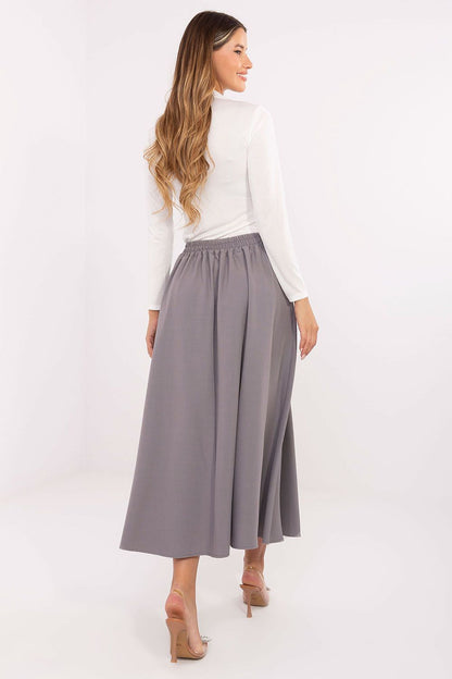 Luxurious midi skirt by Rue Paris showcasing side pockets and a flattering elastic band for comfort.