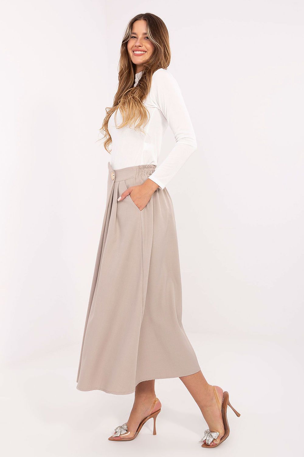 High-quality polyester blend midi skirt by Rue Paris with an elegant draping effect.