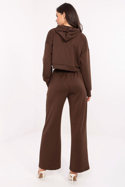 Chic women’s tracksuit set by Rue Paris, featuring a drawstring hoodie and elastic high-waisted trousers, designed for elegance and comfort.