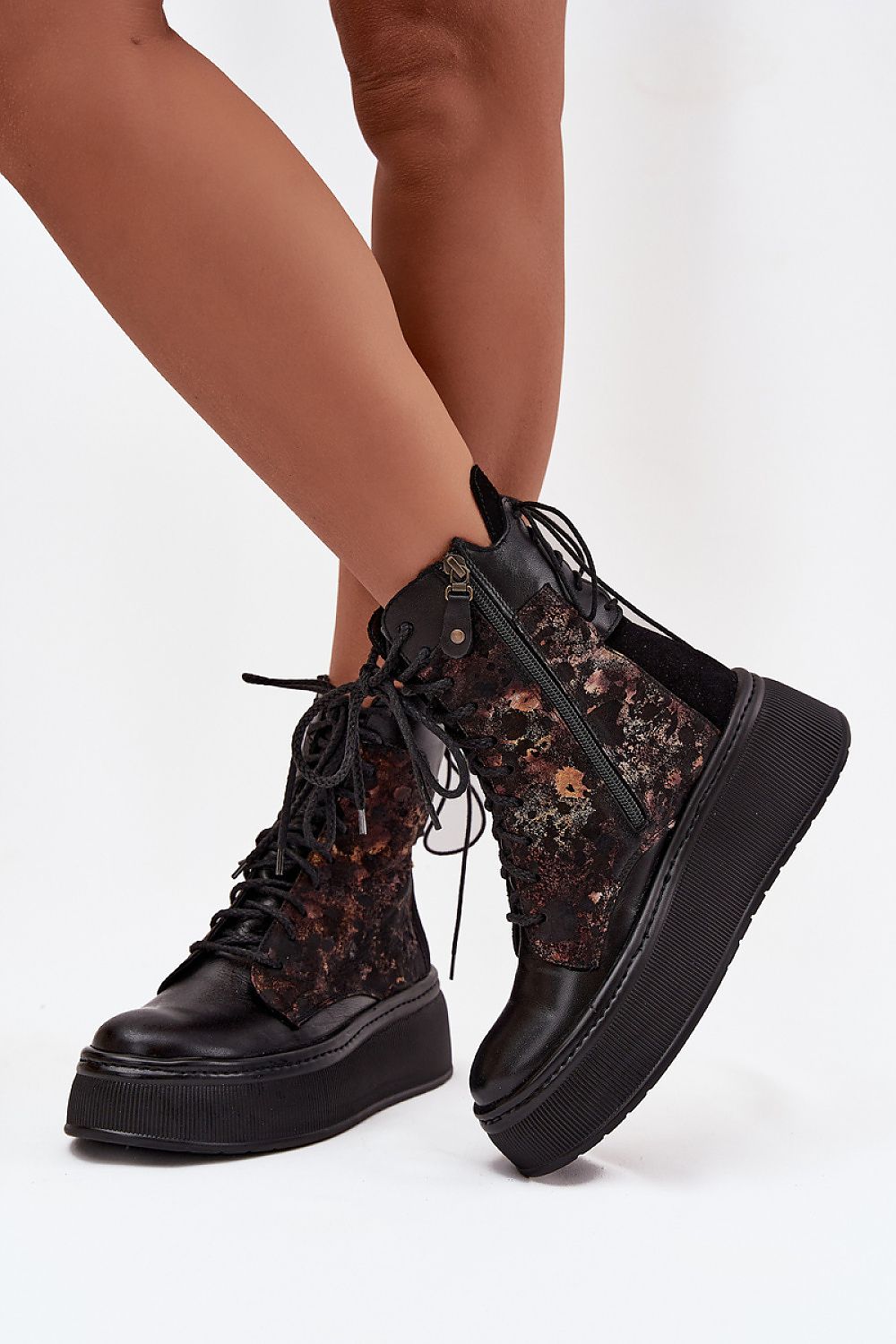 Stylish Maciejka leather boots featuring decorative lacing and a solid platform, perfect for fashionable everyday wear, offered by Step in Style.