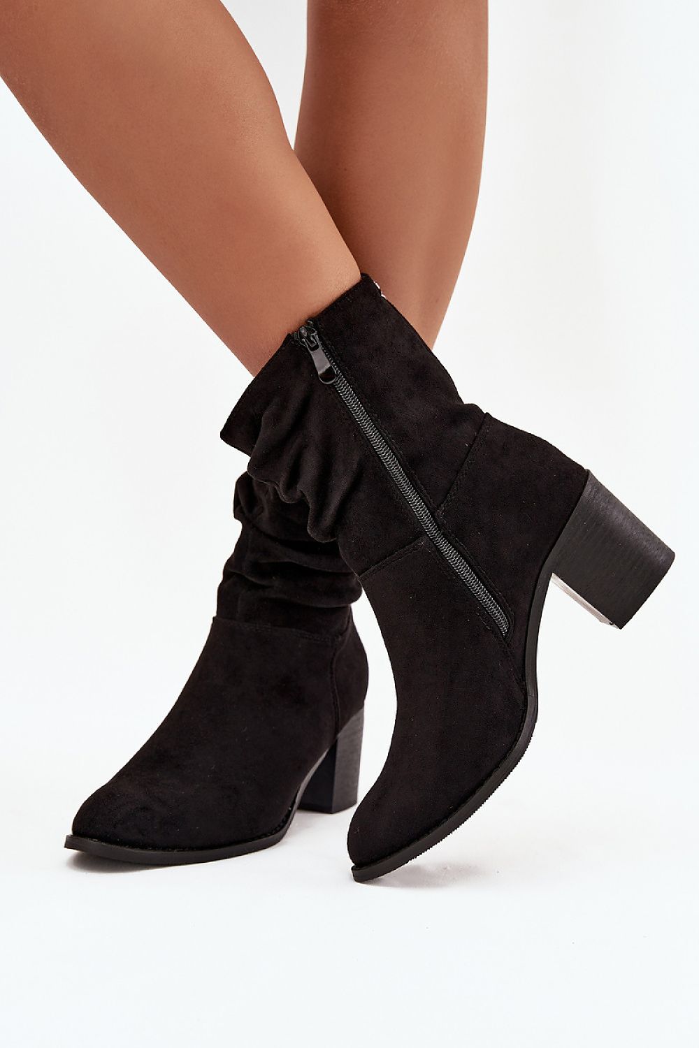 Chic view of Step in Style women's eco suede ankle boots displaying the luxurious column heel and soft material, ideal for elevating any outfit.
