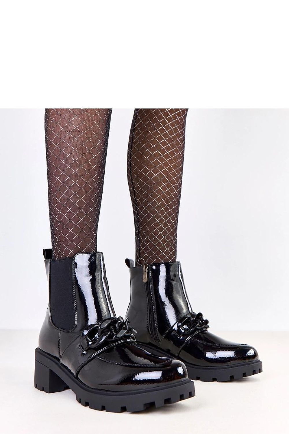 Elegant black ankle boots by Solea, featuring a decorative chain and 5.5 cm heel, crafted from eco-leather for luxurious comfort.