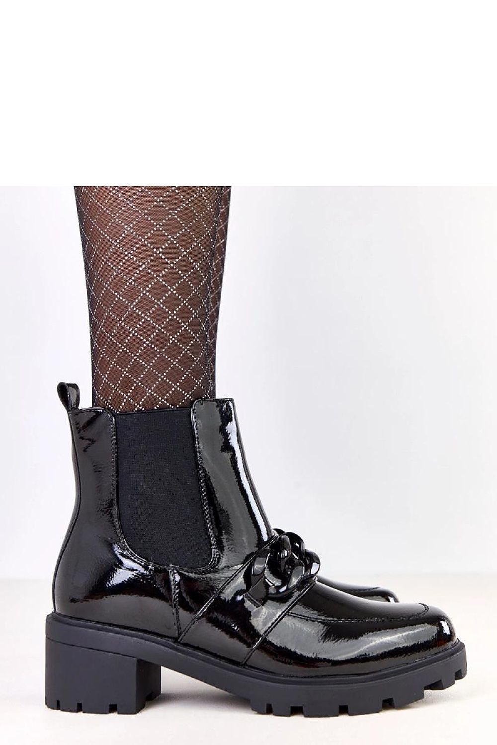 Stylish black eco-leather ankle boots from Solea, adorned with a decorative chain and showcasing a sophisticated design, perfect for modern elegance.