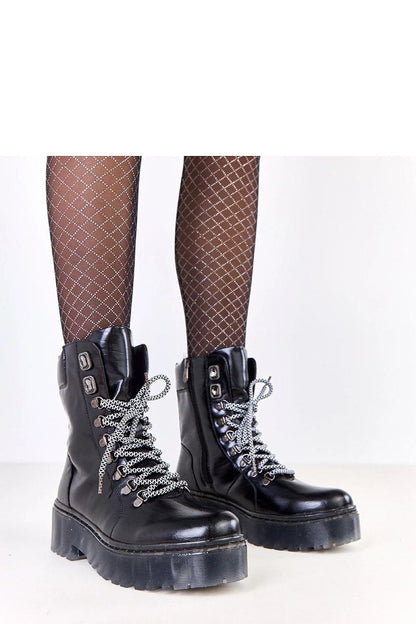 Elegant Solea women's lace-up trapper boots adorned with crystals, featuring a warm interior for comfort during winter.