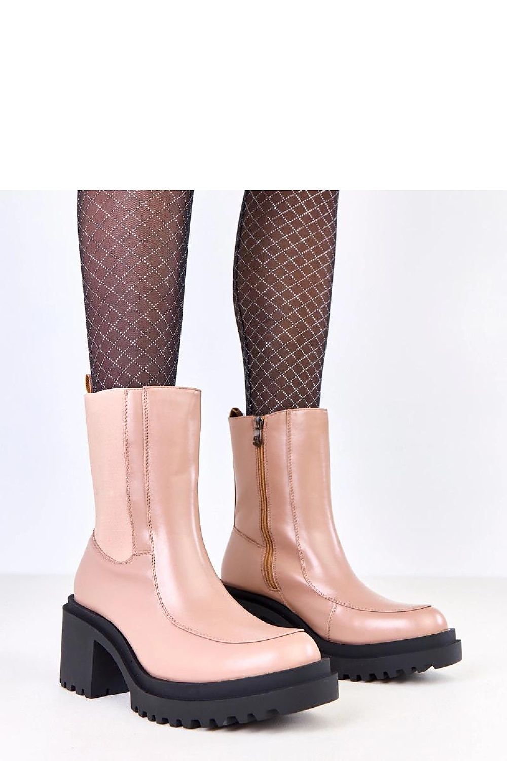 Elegant women's ankle boots by Solea in eco-leather with a 7.5 cm heel, featuring side elastic inserts and a warm interior, perfect for stylish winter outfits.