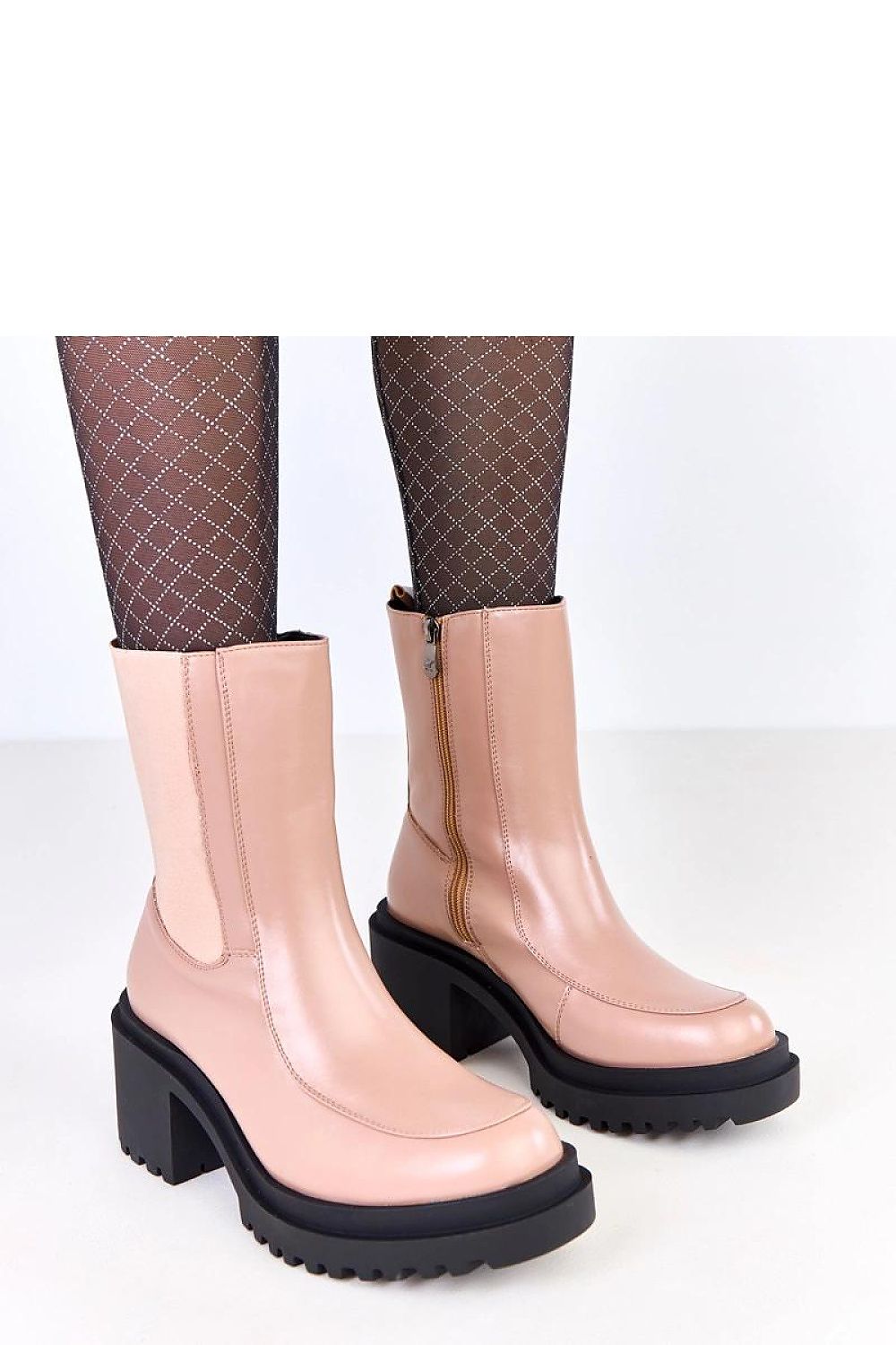 Stylish eco-leather ankle boots for women by Solea, showcasing a fashionable design with a stable 7.5 cm heel and warm lining, ideal for chic and comfortable wear.