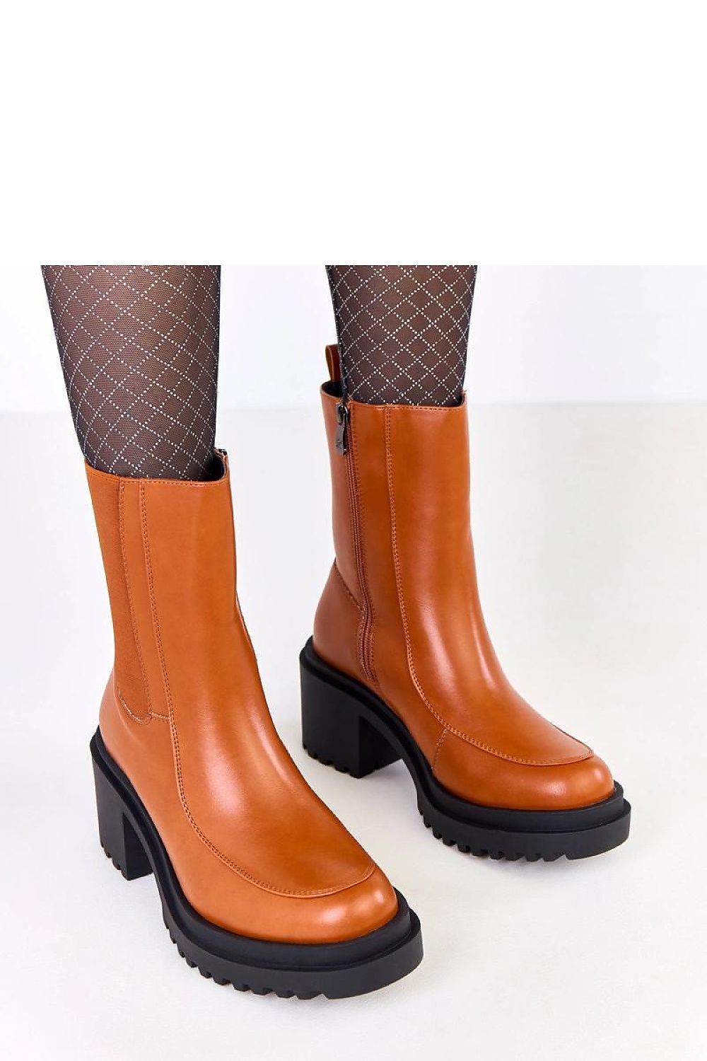 Versatile Solea eco-leather ankle boots with a sophisticated 7.5 cm heel, perfect for enhancing both casual and elegant outfits.