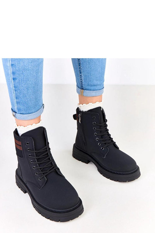 Close-up of Solea Women's Insulated Trapper Boots showcasing the high-quality ecological leather and contrasting fabric inserts.