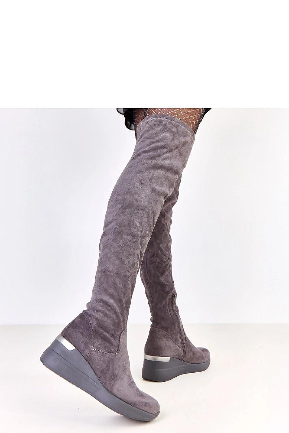 Solea stylish knee-high buskin boots in eco-suede with a wedge heel, showcasing elegance and modern design ideal for trendy outfits.